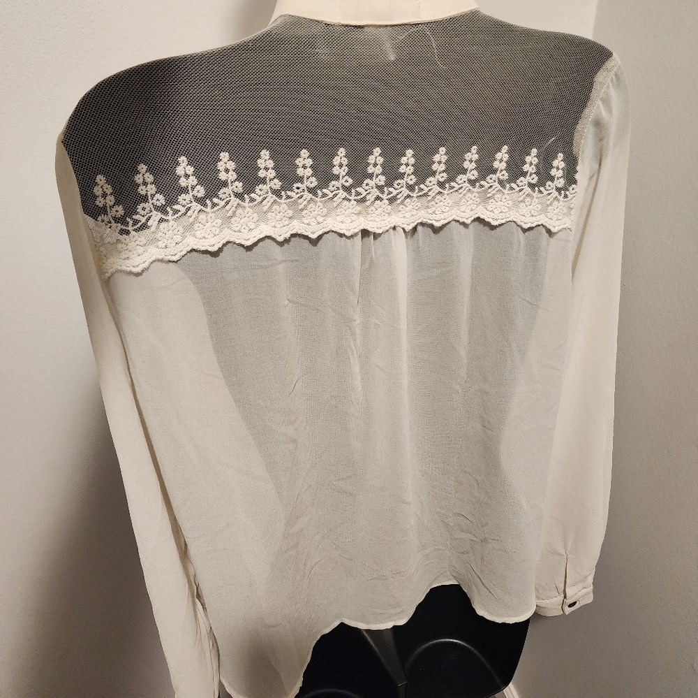 Ivory blouse with Lace shoulders and front tie.